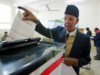Голосование на выборах в Ираке, фото Reuters 