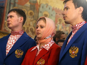 Российские олимпийцы во время молебна. Фото AFP