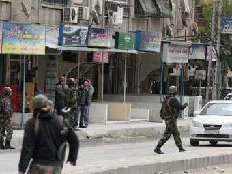 Сирийские военнослужащие в районе Хараста. Фото ©AFP